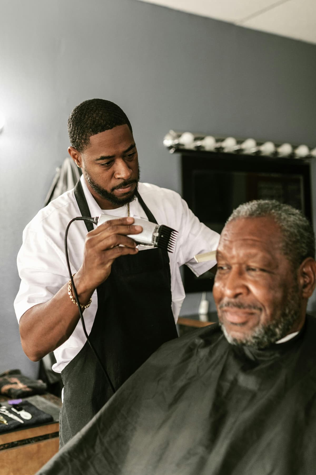 Barber cutting a client's hair